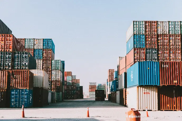 a large amount of containers are stacked on top of each other