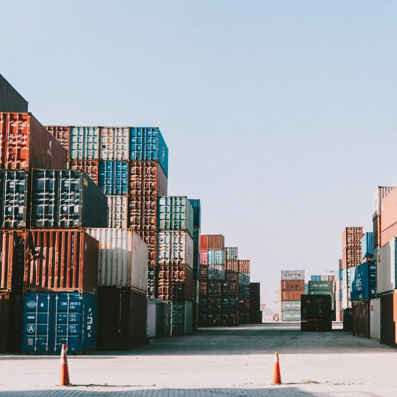 a large amount of containers are stacked on top of each other